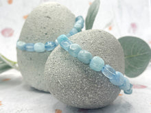Load image into Gallery viewer, Beautiful square to rectangle shaped aquamarine stones on a blue cord with slip knot