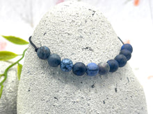 Load image into Gallery viewer, Dumortierite 10 breaths meditation bracelet with blue matte beads on black cord