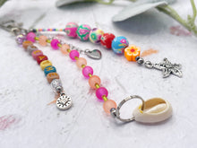 Load image into Gallery viewer, Handbag or key charm accessory with cowrie shell and heart charms and floral summer beachy festival beads, unique gift for her, just breathe