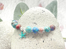 Load image into Gallery viewer, The ten lilac and blue 8mm sea sediment stones with a central turquoise starfish charm making up your 10 breaths bracelet