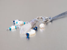 Load image into Gallery viewer, . Quartz Crystal Charm Necklace with Mother Of Pearl Moon and Stars, featuring little pearls on a double cotton cord with extender chain