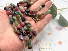 Load image into Gallery viewer, A Calming Tourmaline Bracelet with 10 smooth natural stones, one for each deep breath. For anxiety, overwhelm, and those who need a moment of quiet within.
