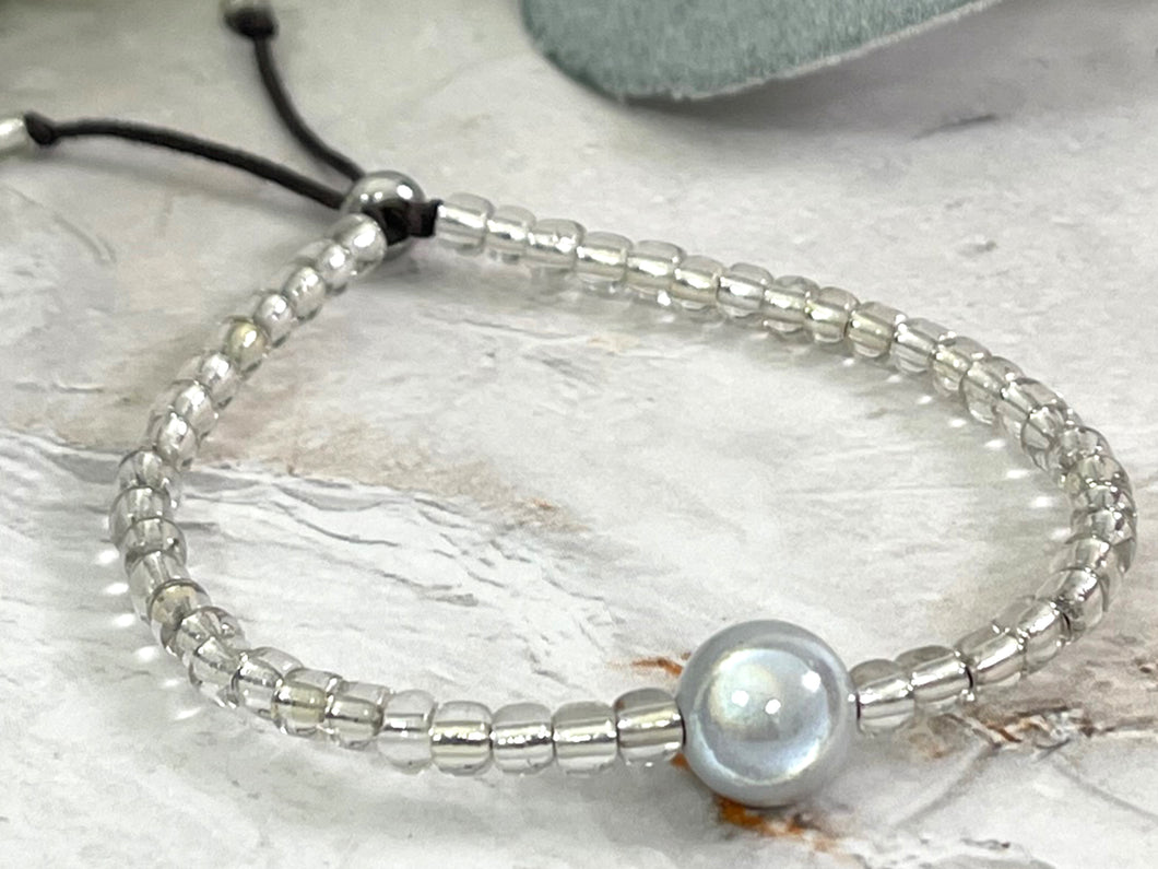 Stacking Bracelet with Central Magic, Illusion bead, hugged by beautiful silver lined glass beads, Great gift for her