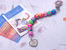 Load image into Gallery viewer, Floral Bead, Bag or Key Charm Gift pack with Heart Charm, for Valentines or Mothers day with Colouring in card, bath fizzes and other curated goodies
