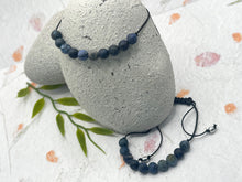 Load image into Gallery viewer, Dumortierite meditation bracelet laid flat showing 10 blue semi-precious stone beads
