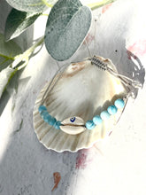 Load image into Gallery viewer, Larimar and Evil eye cowrie shell on the grey cord with sliding knot.
