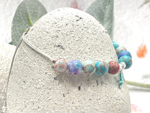 Load image into Gallery viewer, The ten lilac and blue 8mm sea sediment stones with a central turquoise starfish charm making up your 10 breaths bracelet
