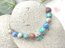 Load image into Gallery viewer, The ten lilac and blue 8mm sea sediment stones with a central turquoise starfish charm making up your 10 breaths bracelet
