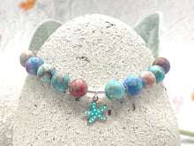 Load image into Gallery viewer, The ten lilac and blue 8mm sea sediment stones with a central turquoise starfish charm making up your 10 breaths bracelet
